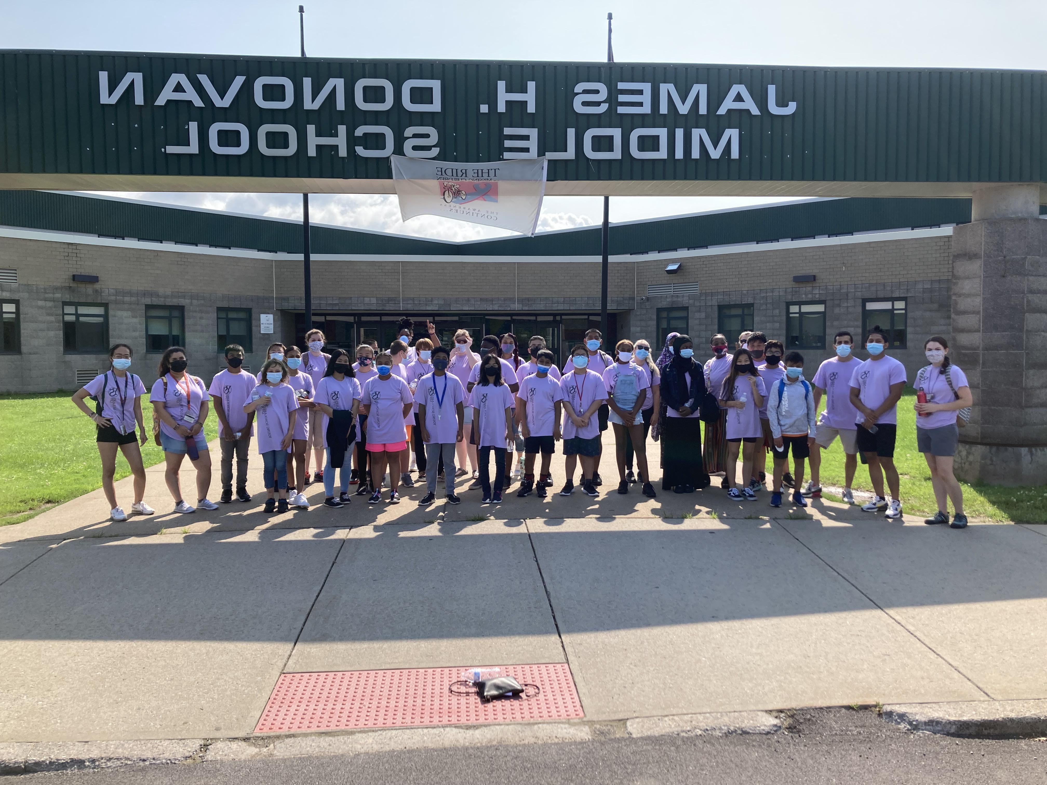 A group of 7th grade Young Scholars posed outside of Donovan Middle School. 